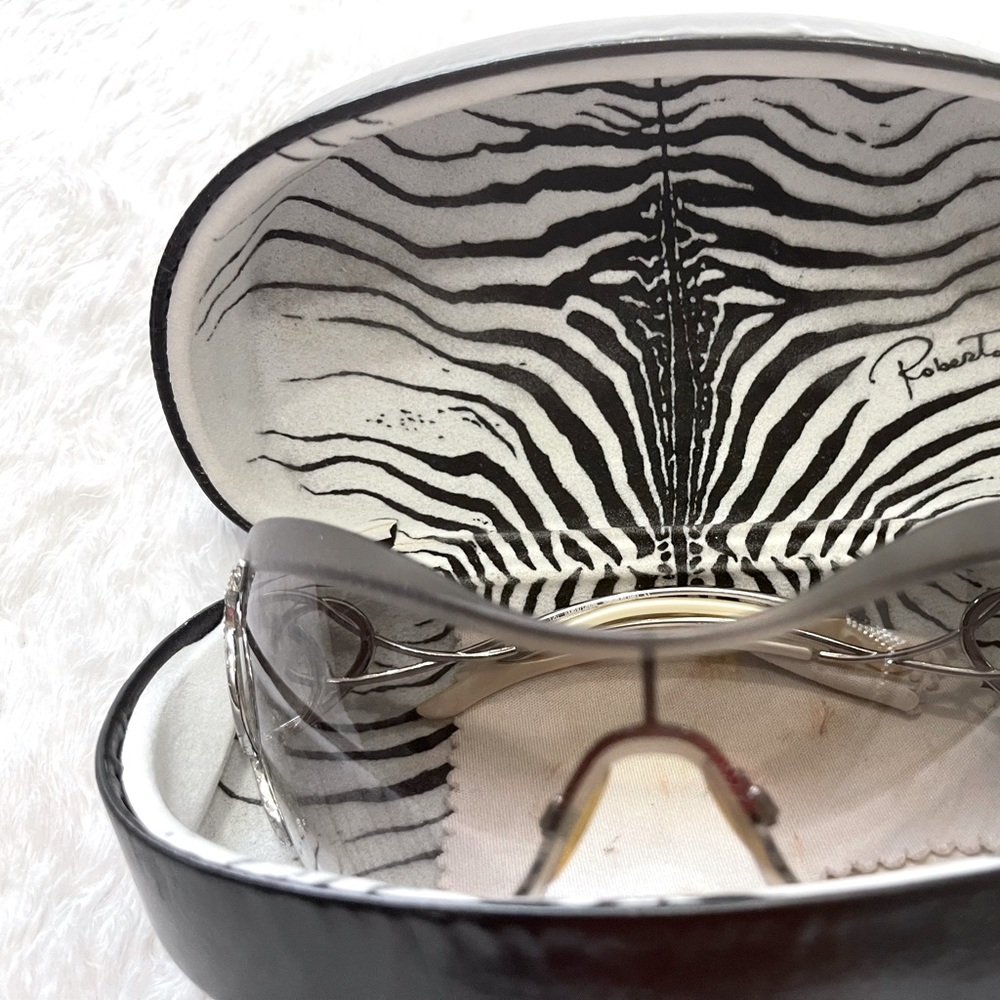I am selling authentic Roberto Cavalli sunglasses , it is one size ,gray color